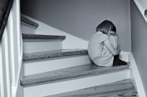 Child sitting on stairs